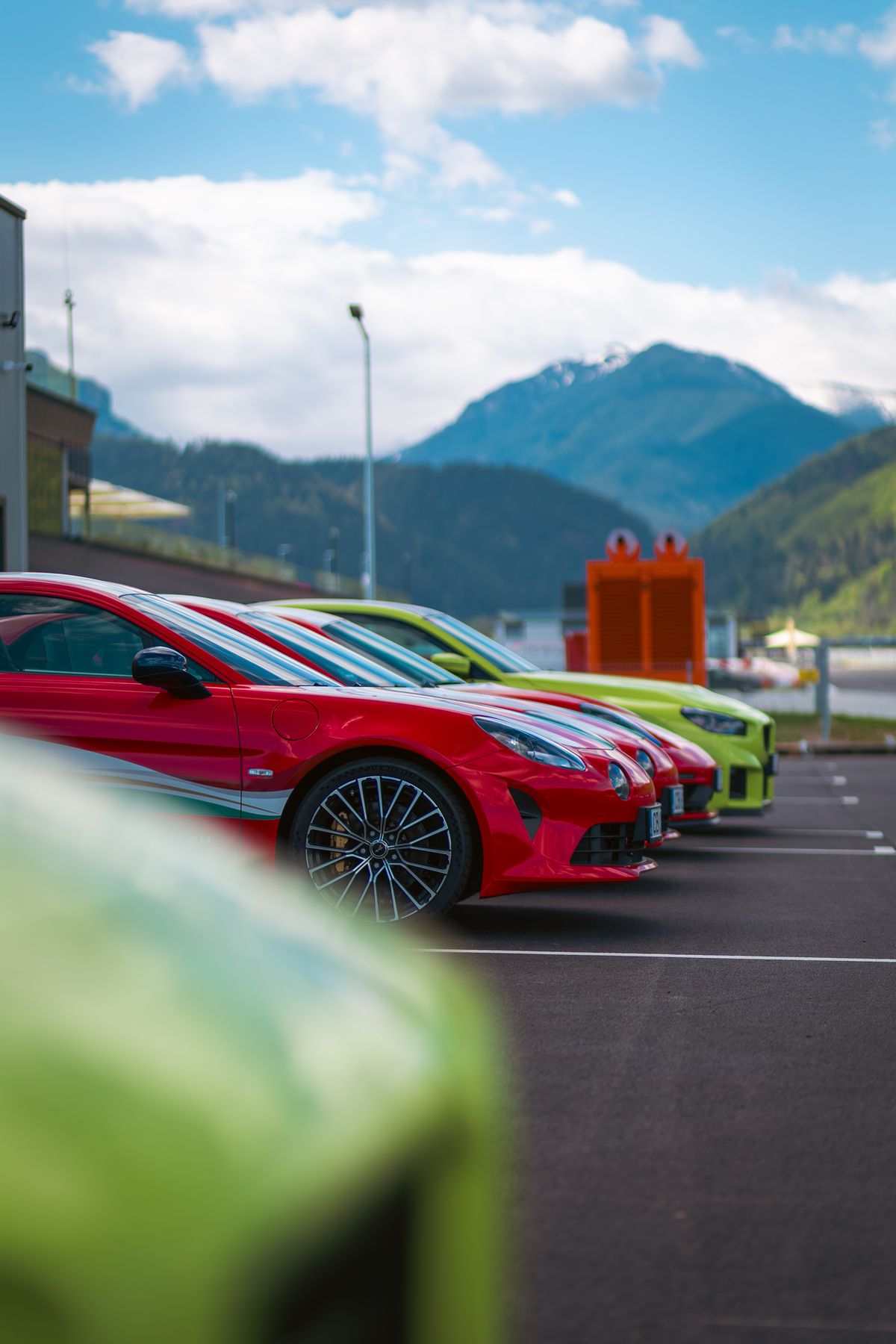 Paddock line-up, mountains behind