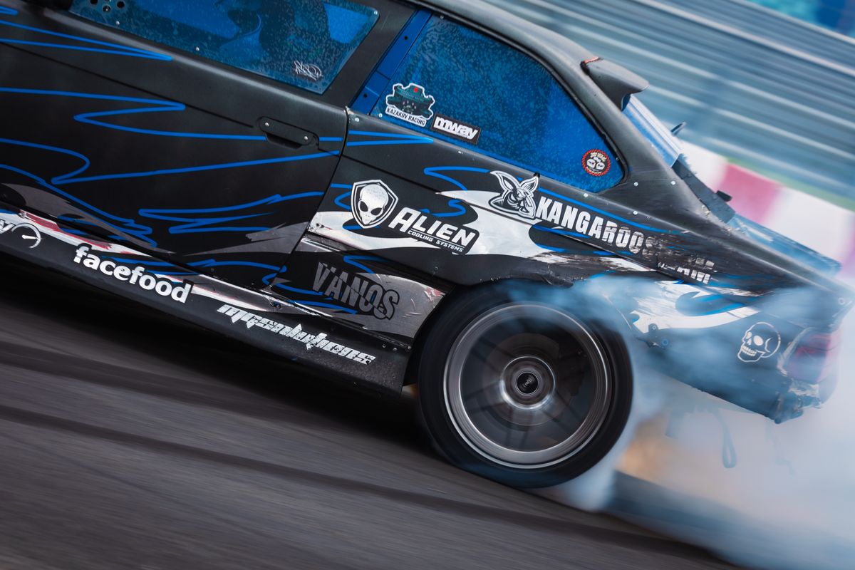 Close-up of a drift car: tyres going up in smoke